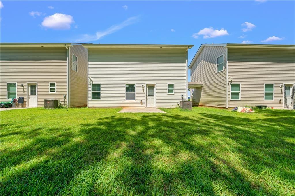 631 Carlton Pointe Drive, Unit 24 Palmetto, GA 30268 - Photo 20 of 20 a front view of house with yard