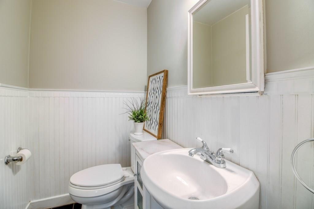 343 Plumtree Road Springfield, MA 01118 - Photo 7 of 27 a bathroom with a sink a toilet and mirror