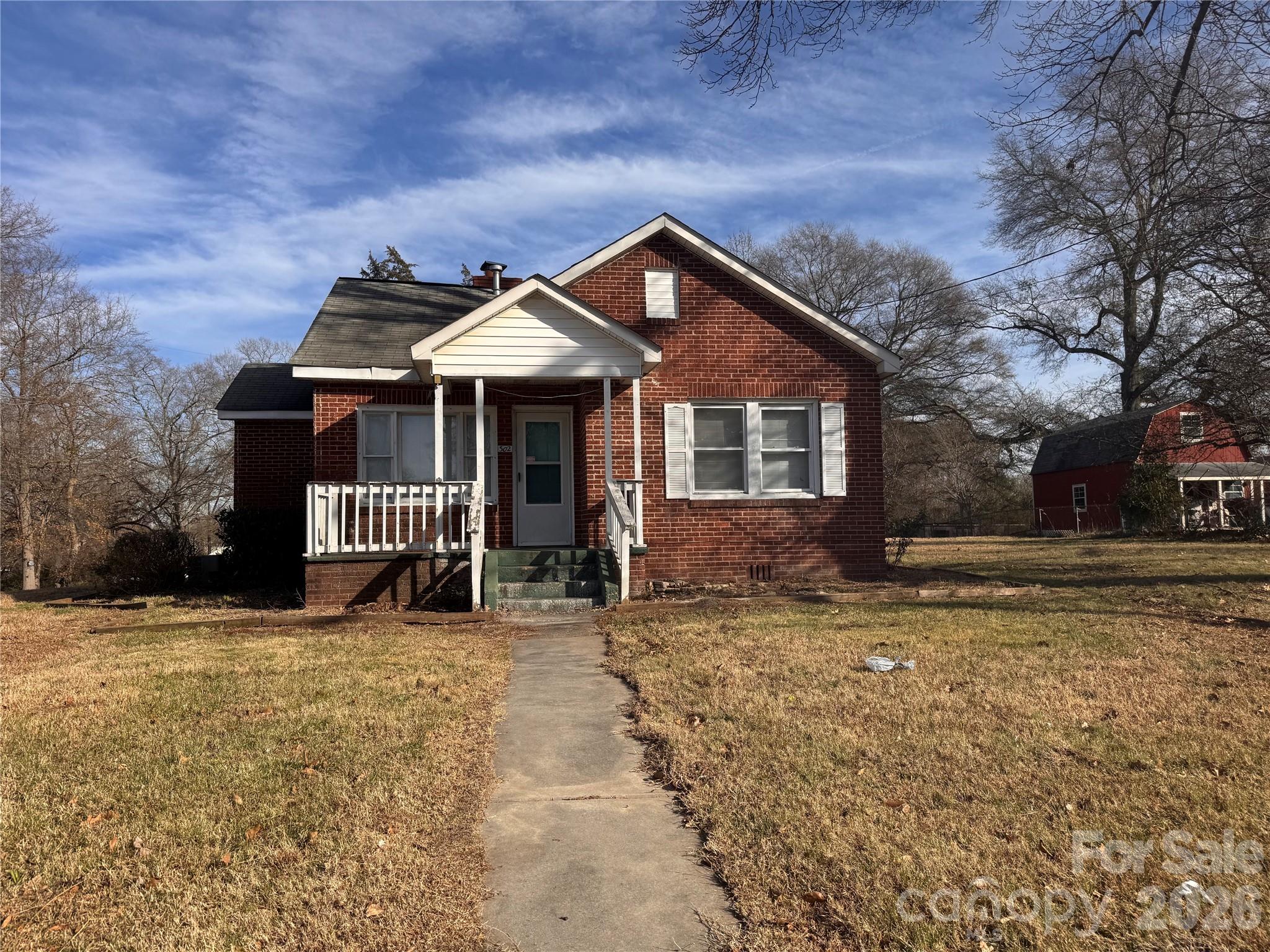 302 South Myrtle School Road Gastonia, NC 28052 - Photo 1 of 27 a view of a house with a yard and fence