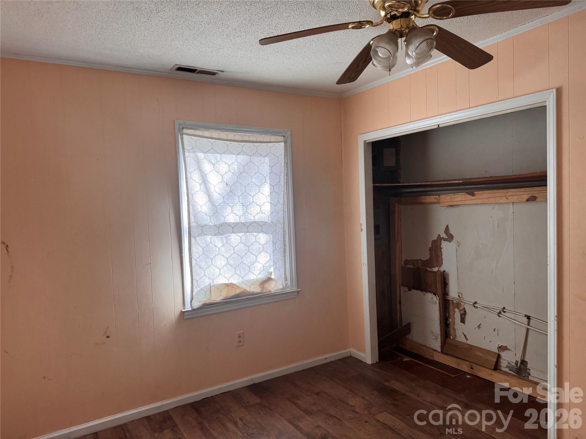 302 South Myrtle School Road Gastonia, NC 28052 - Photo 16 of 27 a view of an empty room with a window and wooden floor