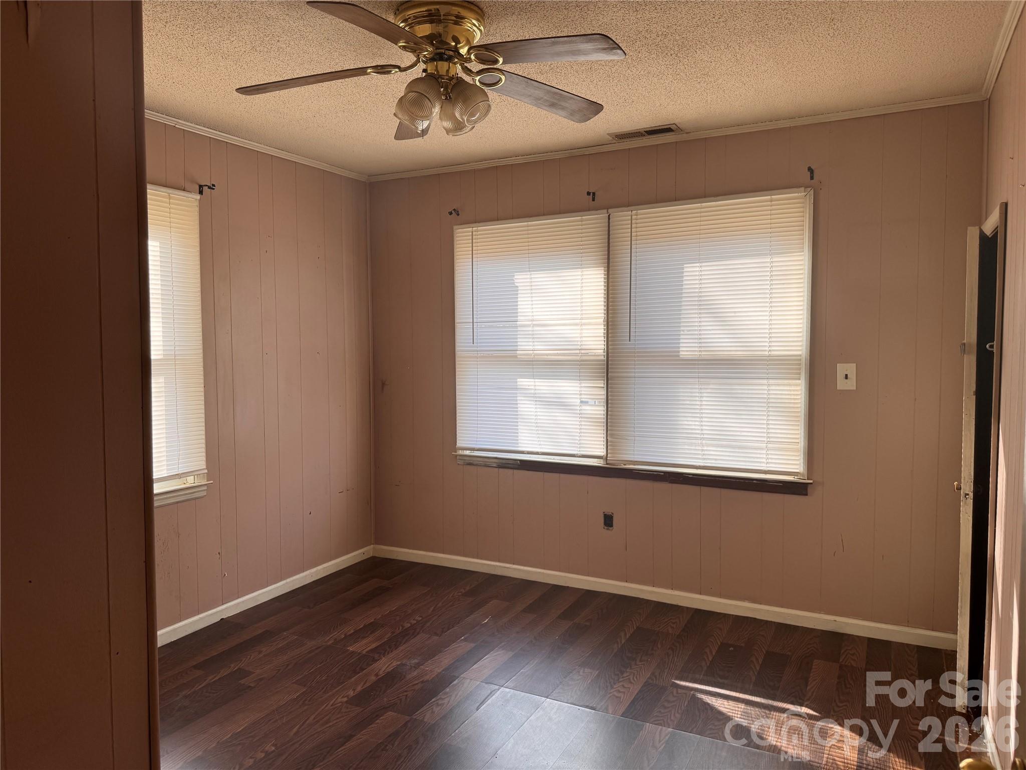 302 South Myrtle School Road Gastonia, NC 28052 - Photo 21 of 27 a view of an empty room with wooden floor and a window