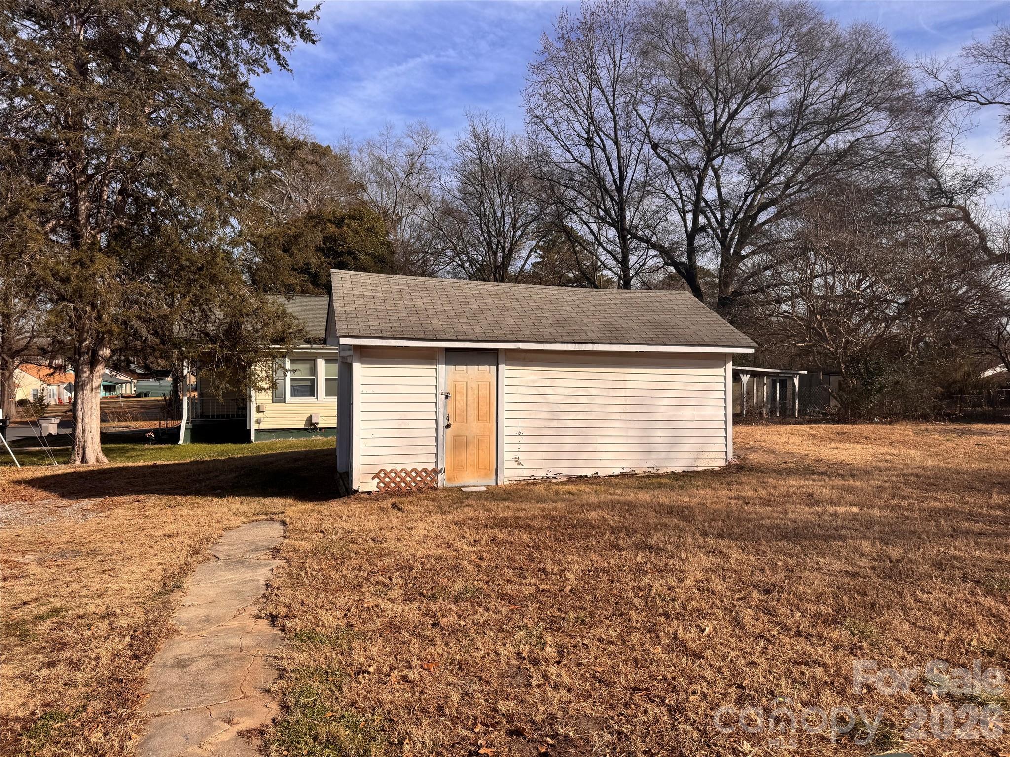 302 South Myrtle School Road Gastonia, NC 28052 - Photo 24 of 27 a view of a house with a yard
