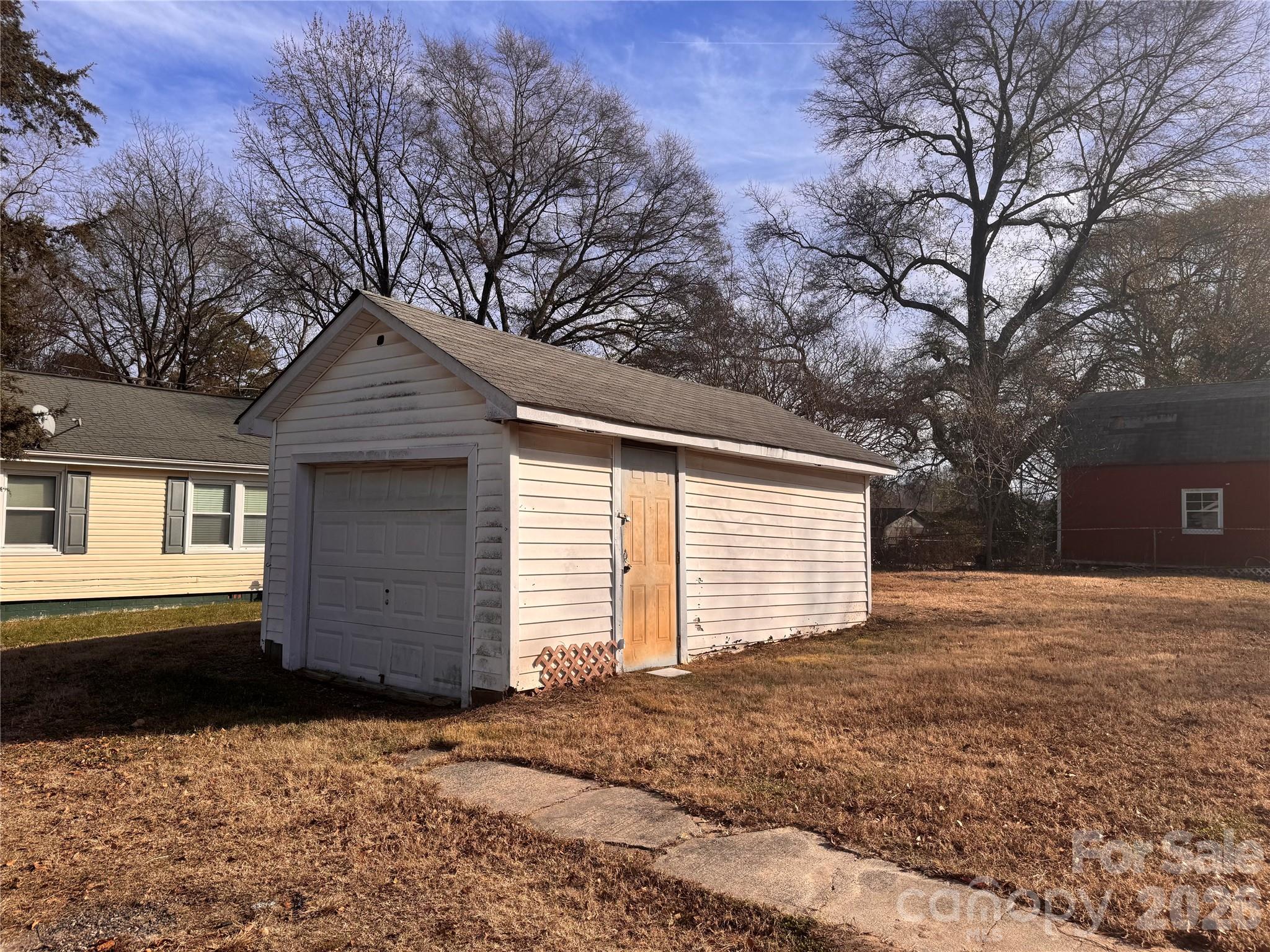 302 South Myrtle School Road Gastonia, NC 28052 - Photo 25 of 27 a front view of a house with a yard and garage
