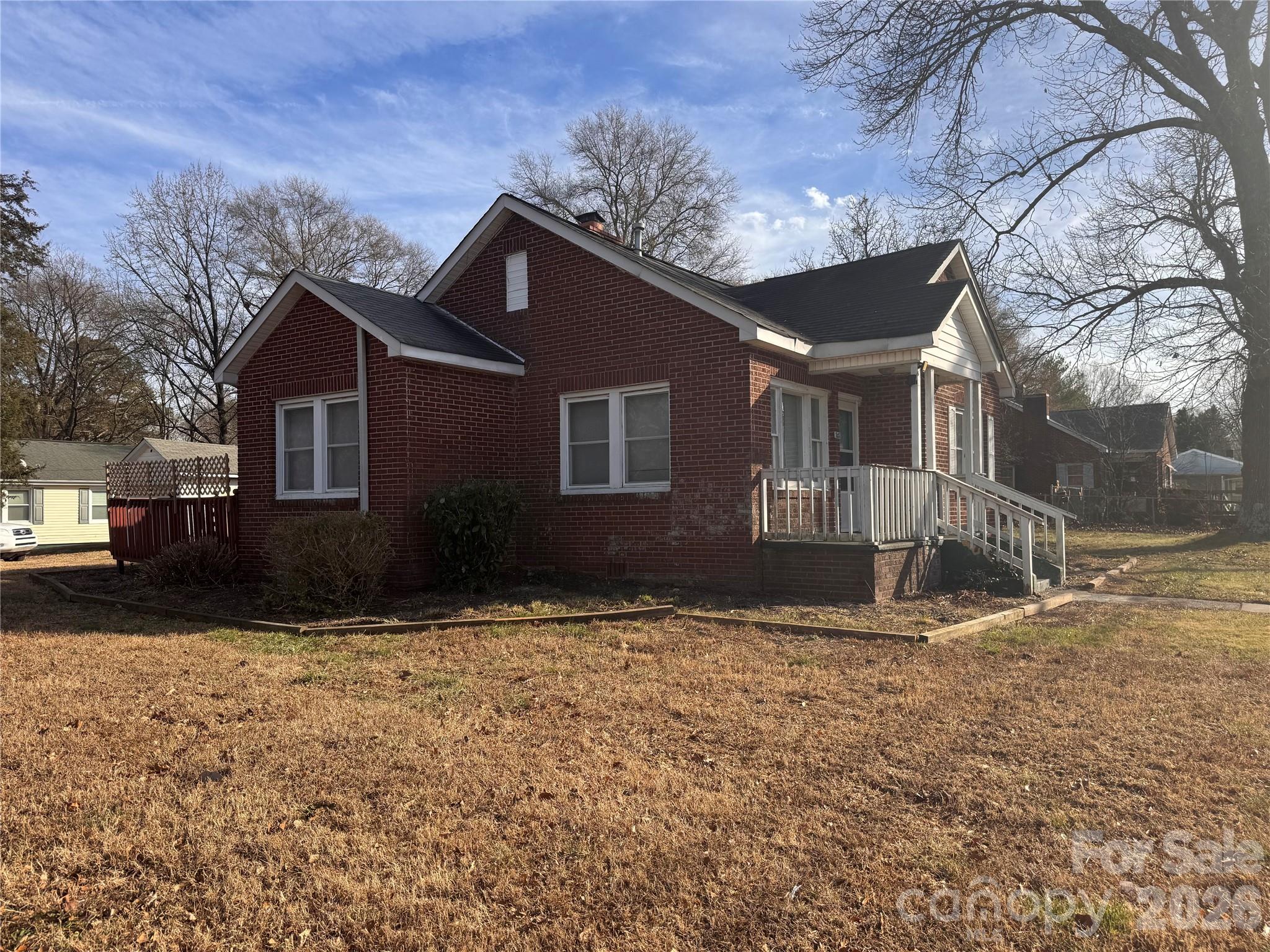 302 South Myrtle School Road Gastonia, NC 28052 - Photo 4 of 27 a house that has a tree in front of it