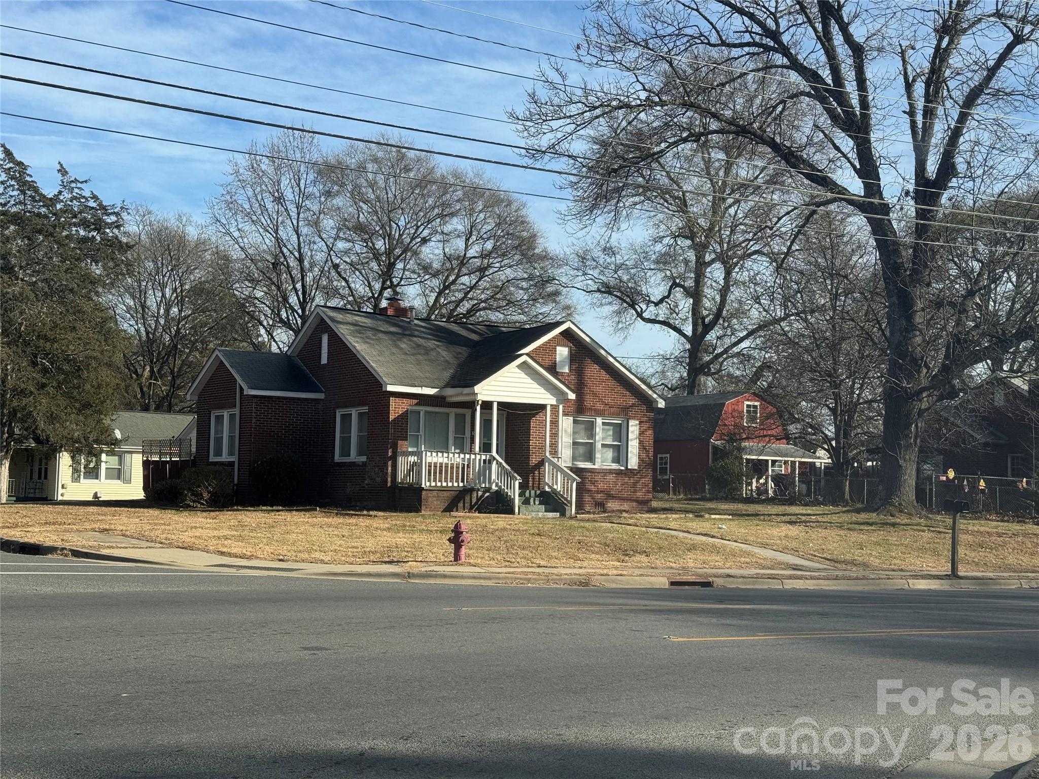 302 South Myrtle School Road Gastonia, NC 28052 - Photo 5 of 27 a front view of a house with a yard