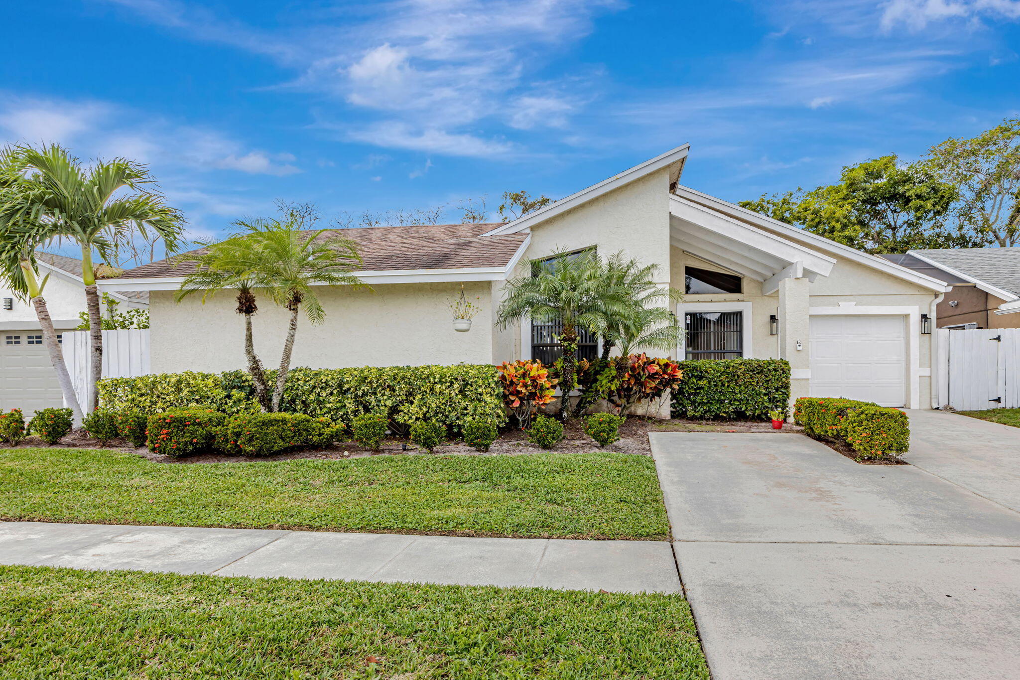 21356 Summertrace Circle Boca Raton, FL 33428 - Photo 1 of 33 a front view of a house with a yard