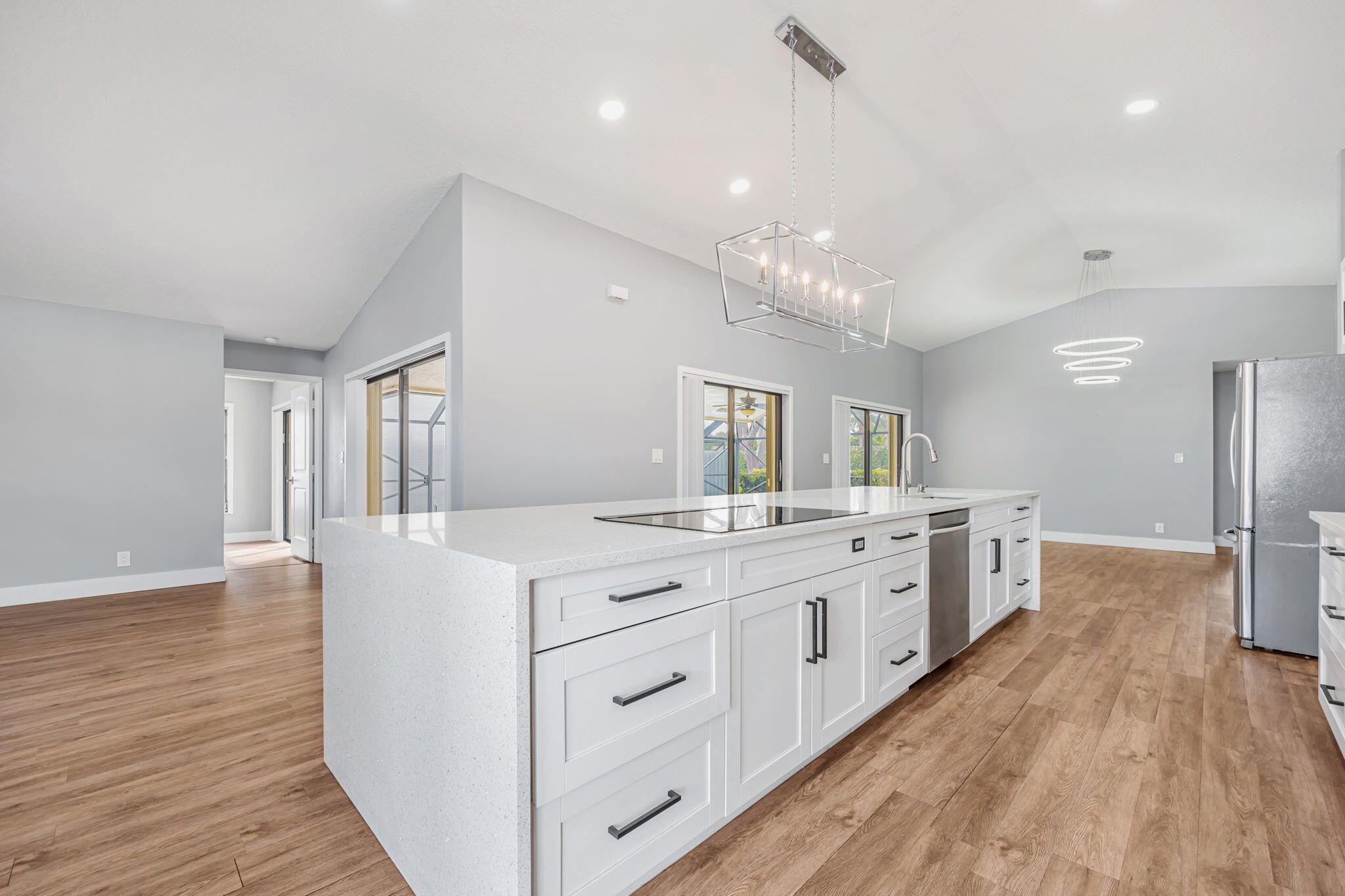 21356 Summertrace Circle Boca Raton, FL 33428 - Photo 2 of 33 a large kitchen with a lot of counter space and wooden floor