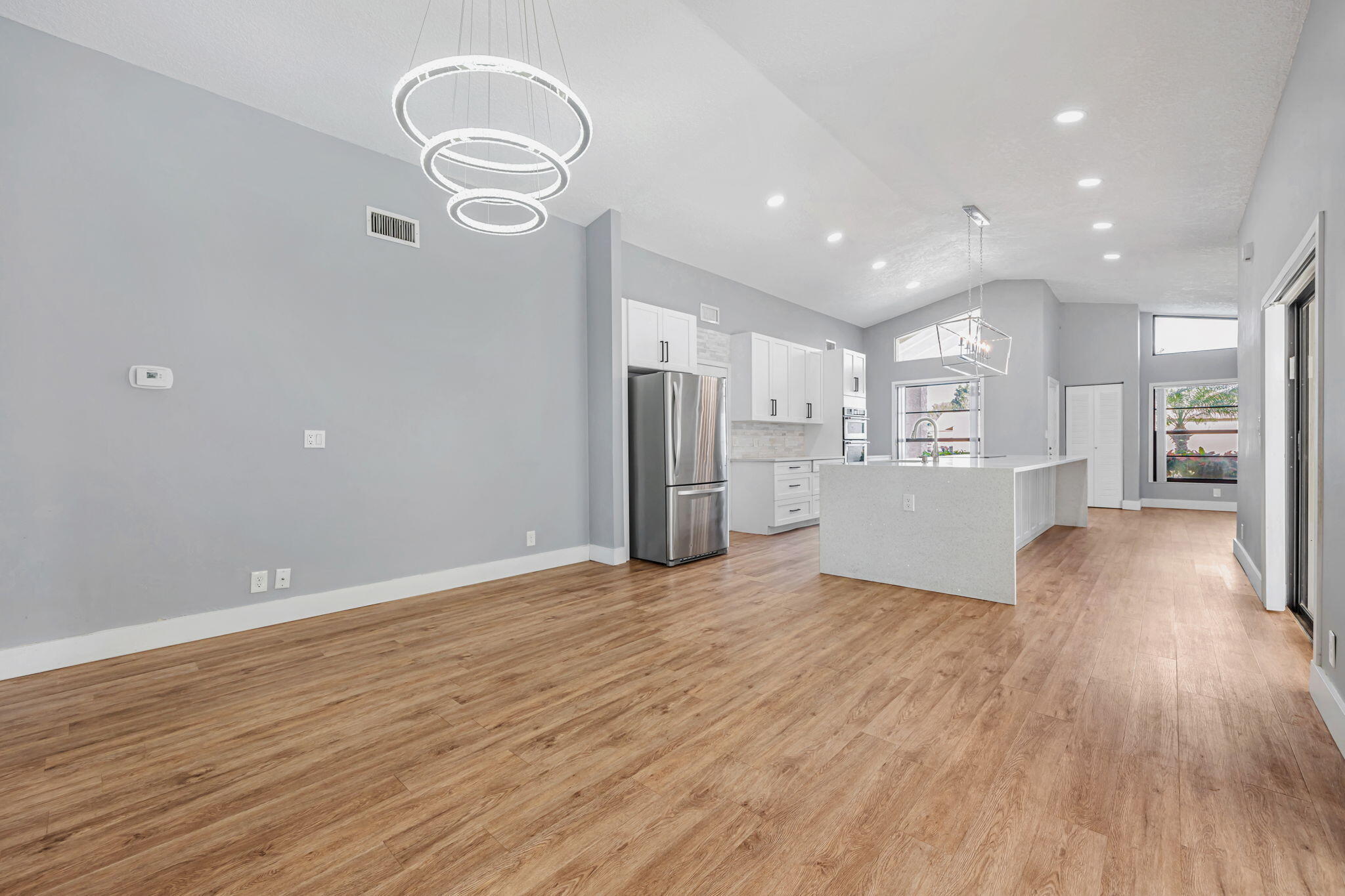 21356 Summertrace Circle Boca Raton, FL 33428 - Photo 7 of 33 a view of a kitchen with wooden floor and a kitchen