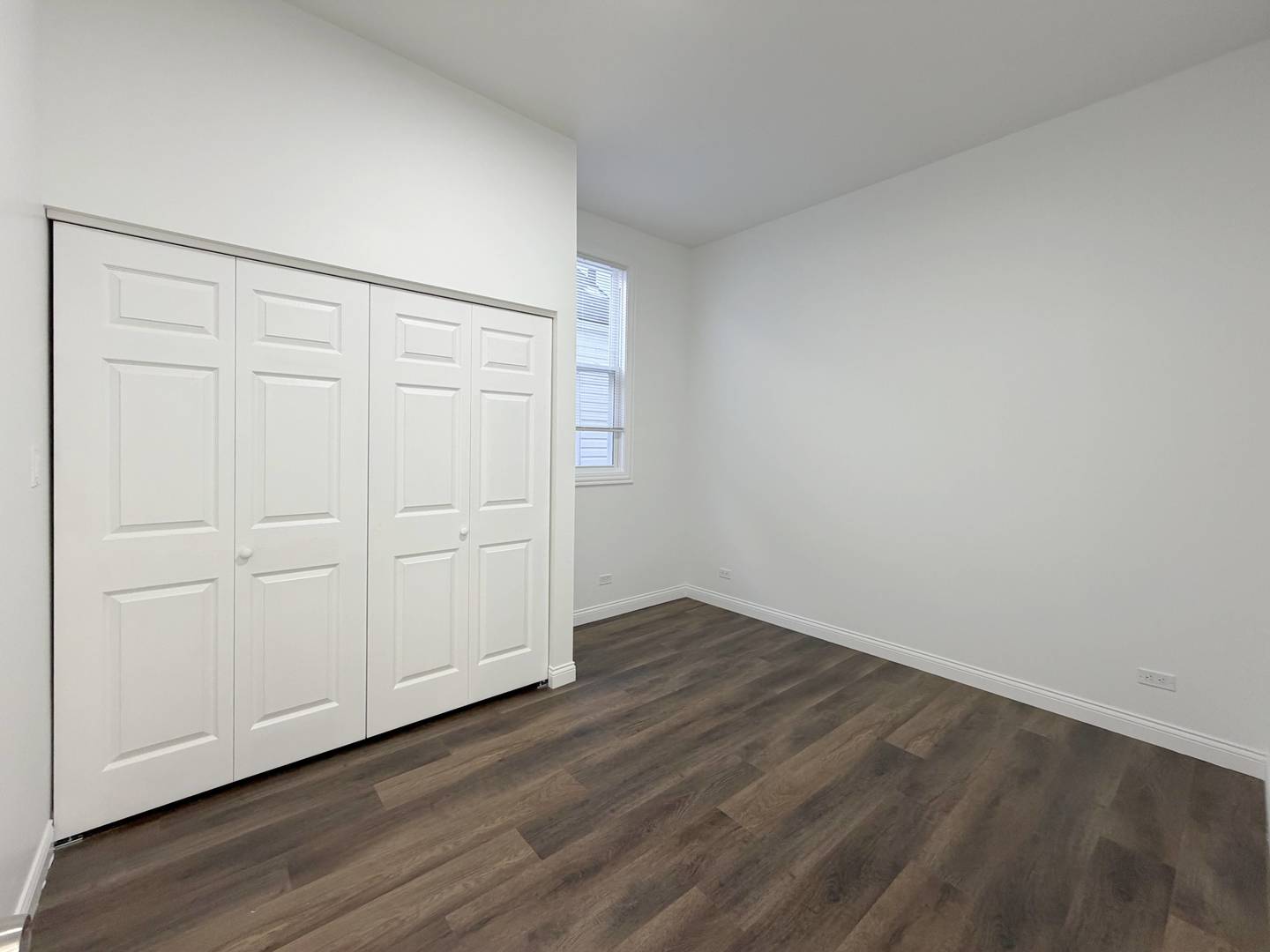 2982 South Lyman Street Chicago, IL 60608 - Photo 12 of 30 a view of an empty room and wooden floor