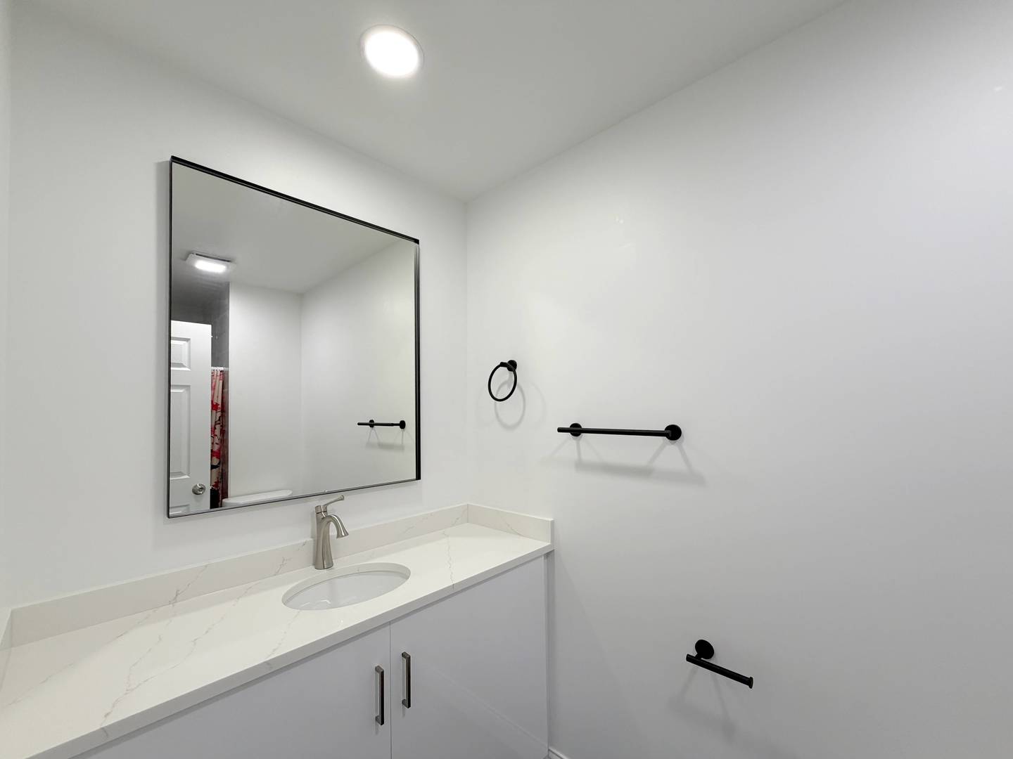 2982 South Lyman Street Chicago, IL 60608 - Photo 14 of 30 a bathroom with a sink and mirror