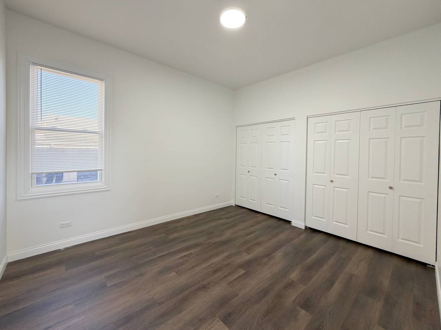 2982 South Lyman Street Chicago, IL 60608 - Photo 24 of 30 a view of an empty room with wooden floor