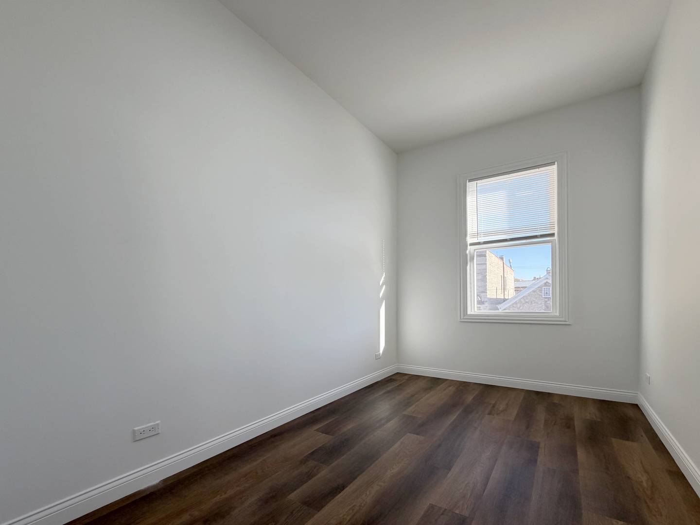 2982 South Lyman Street Chicago, IL 60608 - Photo 25 of 30 an empty room with wooden floor and windows
