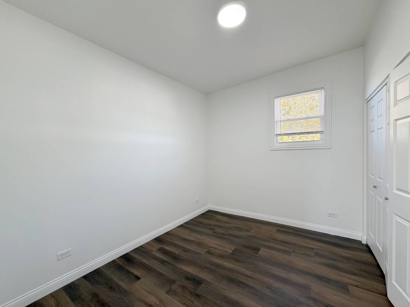 2982 South Lyman Street Chicago, IL 60608 - Photo 27 of 30 a view of a room with wooden floor and white walls
