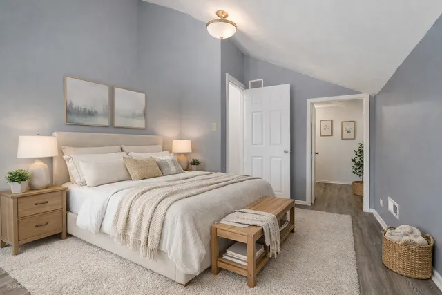 a view of a room with wooden floor