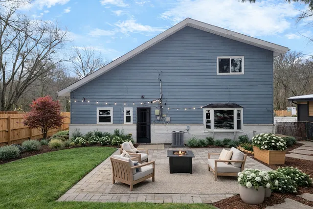 a front view of a house with a garden and patio