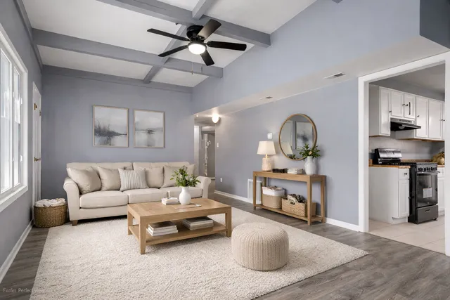 en empty room with window and wooden floor