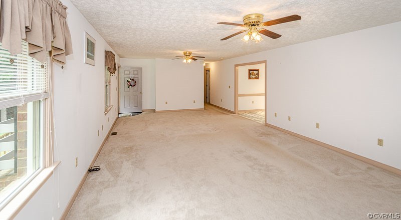 619 Broad St Road Manakin-Sabot, VA 23103 - Photo 12 of 49 a view of a big room with chandelier fan and windows