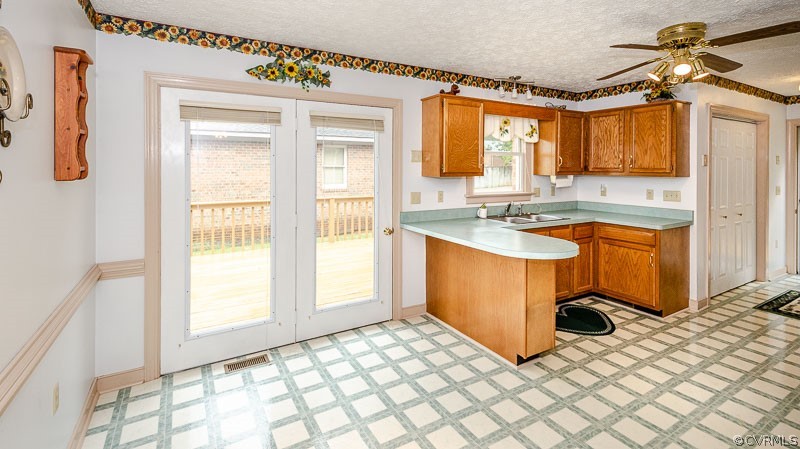 619 Broad St Road Manakin-Sabot, VA 23103 - Photo 17 of 49 a kitchen with stainless steel appliances granite countertop a stove a sink and a refrigerator
