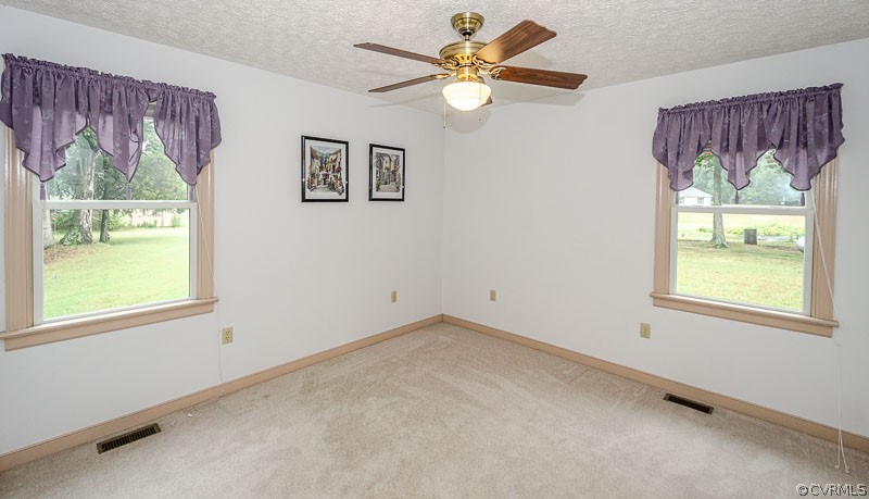 619 Broad St Road Manakin-Sabot, VA 23103 - Photo 30 of 49 an empty room with a window and a fan