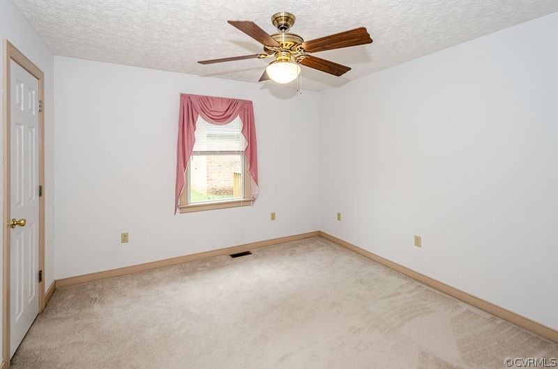 619 Broad St Road Manakin-Sabot, VA 23103 - Photo 31 of 49 an empty room with windows and fan