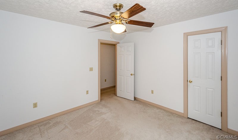 619 Broad St Road Manakin-Sabot, VA 23103 - Photo 33 of 49 an empty room with closet and a chandelier fan