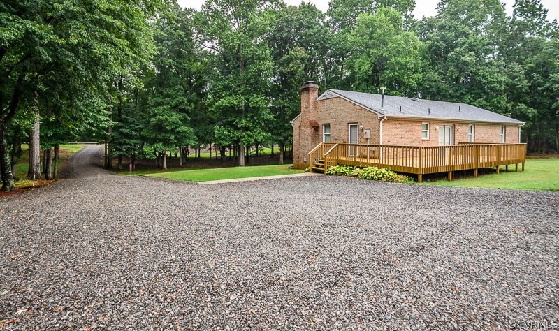 619 Broad St Road Manakin-Sabot, VA 23103 - Photo 43 of 49 a house with trees in the background
