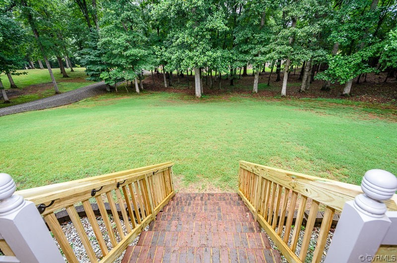 619 Broad St Road Manakin-Sabot, VA 23103 - Photo 6 of 49 a view of a wooden deck and a backyard