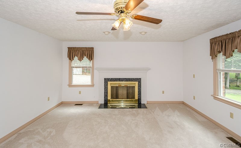 619 Broad St Road Manakin-Sabot, VA 23103 - Photo 8 of 49 an empty room with windows and chandelier fan