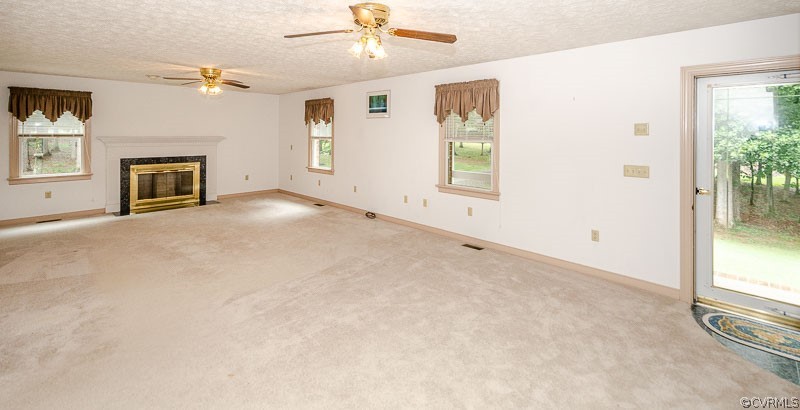 619 Broad St Road Manakin-Sabot, VA 23103 - Photo 10 of 49 an empty room with windows and fireplace