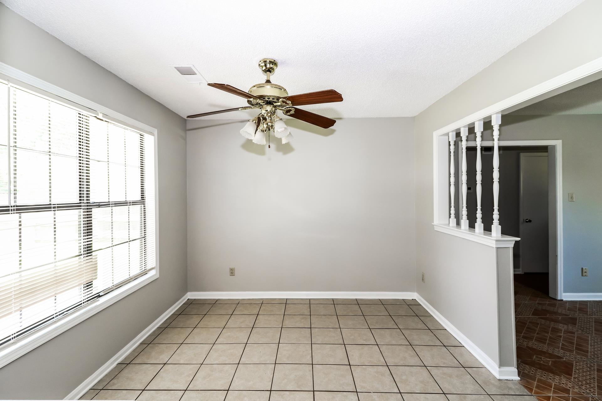 4475 Window Drive Memphis, TN 38135 - Photo 4 of 16 Spare room featuring a ceiling fan and light tile patterned floors