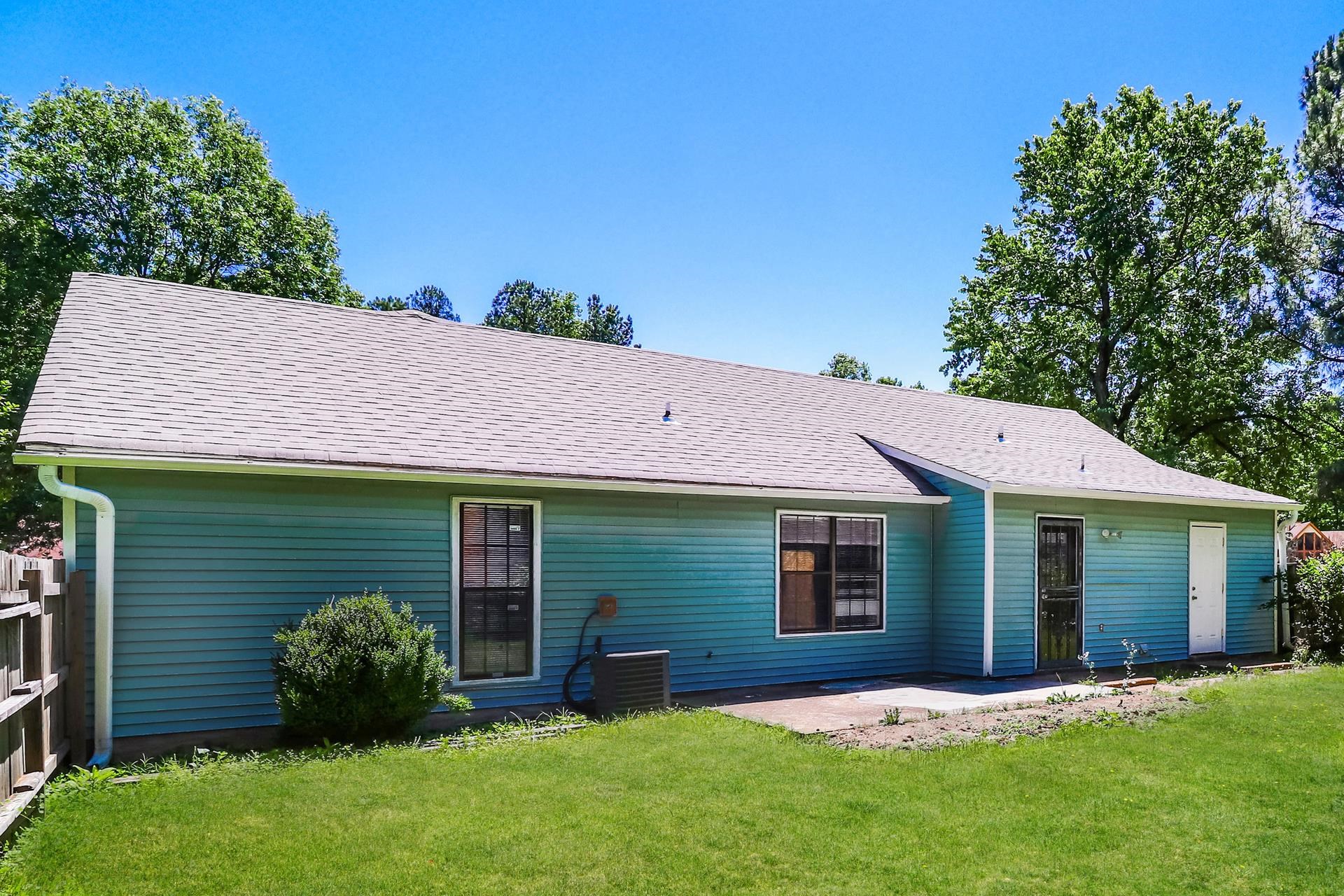 4475 Window Drive Memphis, TN 38135 - Photo 9 of 16 Rear view of property with a patio, a lawn, and roof with shingles