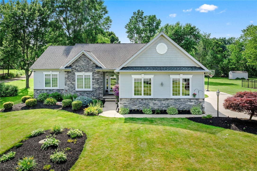 7644 Morley Road Mentor, OH 44060 - Photo 3 of 50 View of front of house with beautiful landscaped beds and covered entry