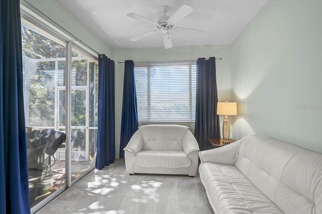 103 Bishopscourt Road Osprey, FL 34229 - Photo 16 of 55 a living room with furniture and a large window