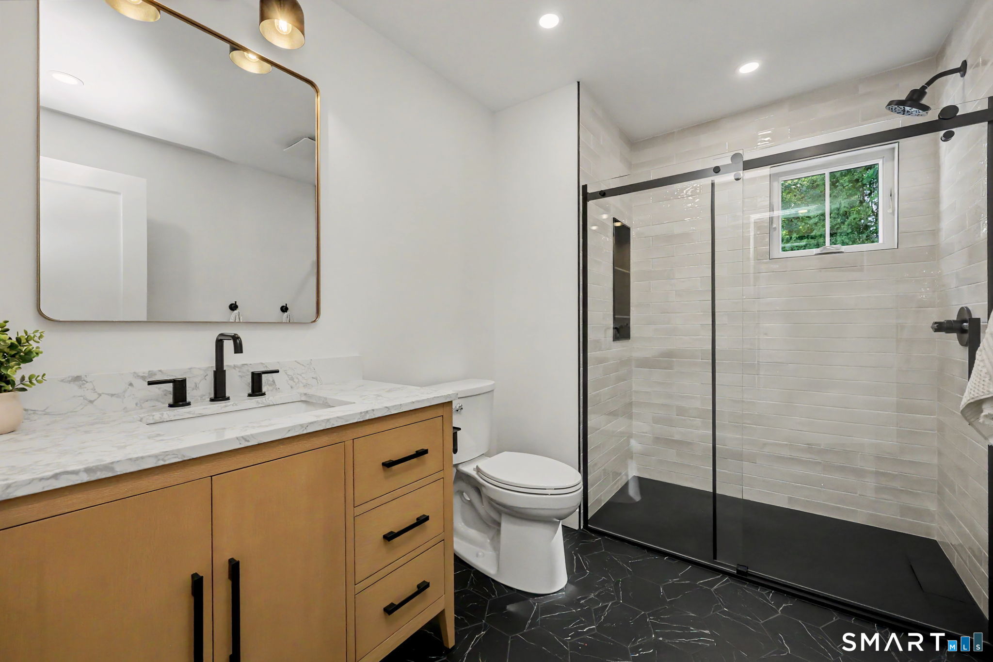 91 Lockwood Road Fairfield, CT 06825 - Photo 23 of 38 a bathroom with a granite countertop sink toilet and shower