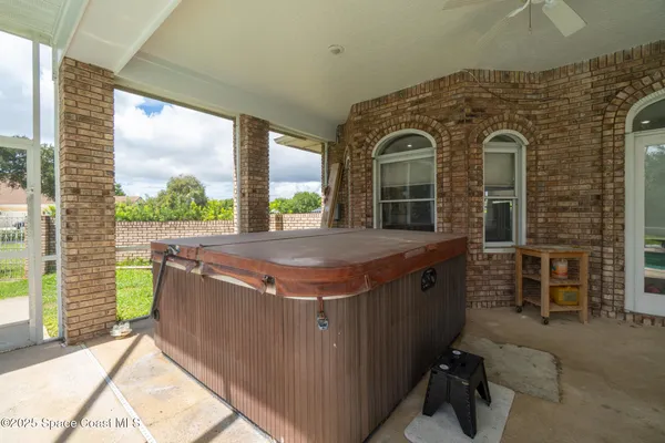 a kitchen that has a lot of cabinets in it and stainless steel appliances