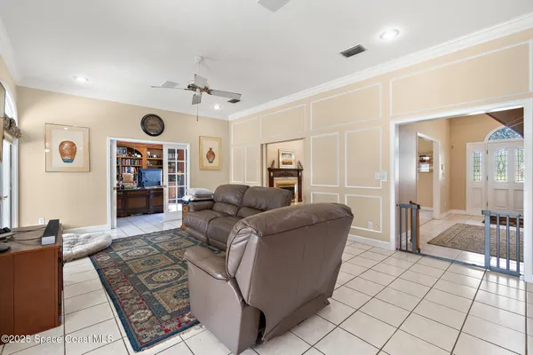 a kitchen with stainless steel appliances granite countertop a stove a refrigerator and a white cabinets
