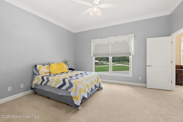 a picture of a room with a white wall and a painting