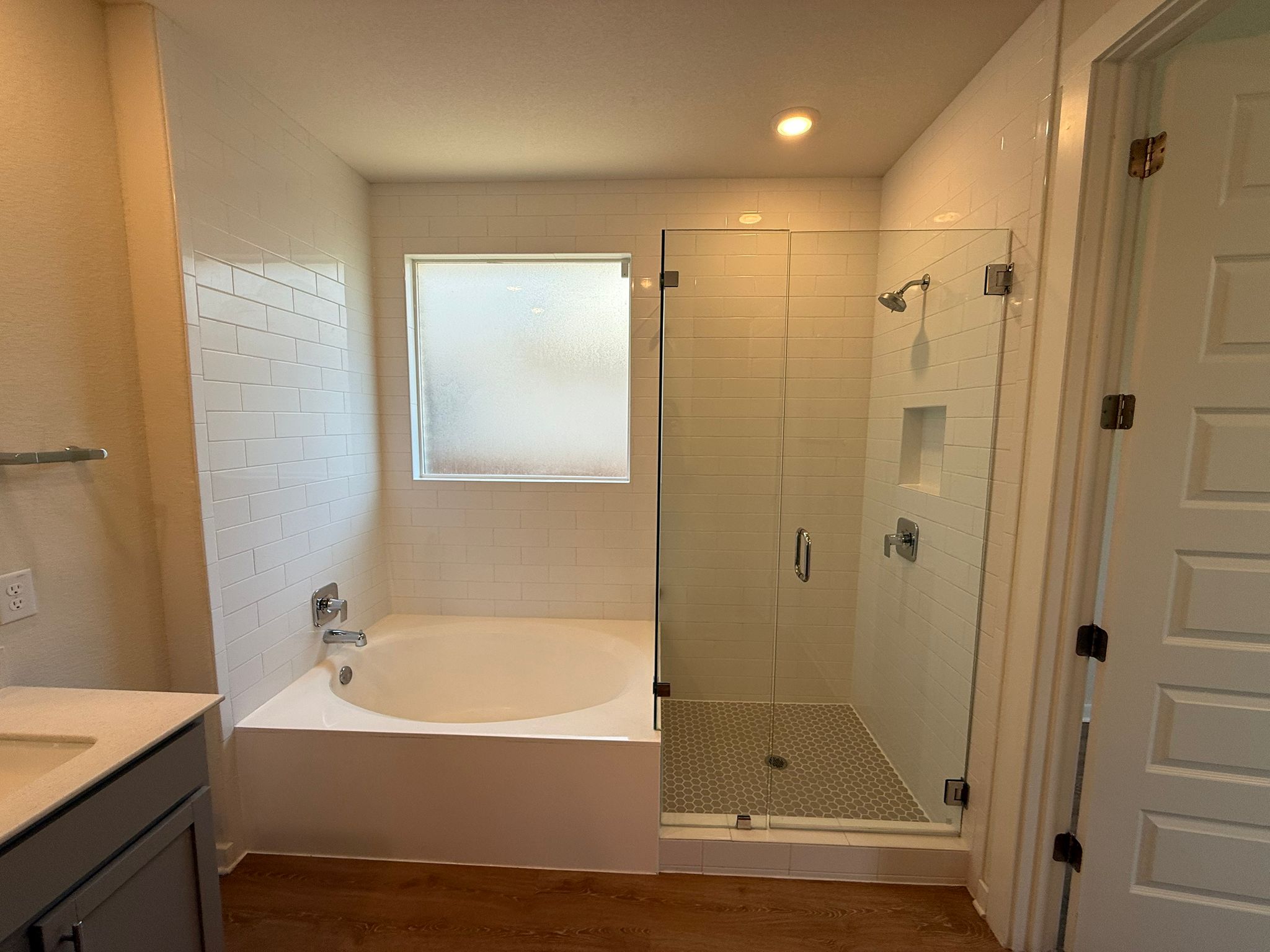 2037 Saddlery Street Leander, TX 78641 - Photo 11 of 38 a bathroom with a bathtub and a shower