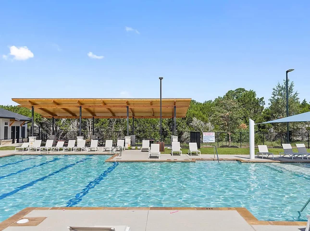 2037 Saddlery Street Leander, TX 78641 - Photo 2 of 38 a view of a swimming pool with an outdoor seating