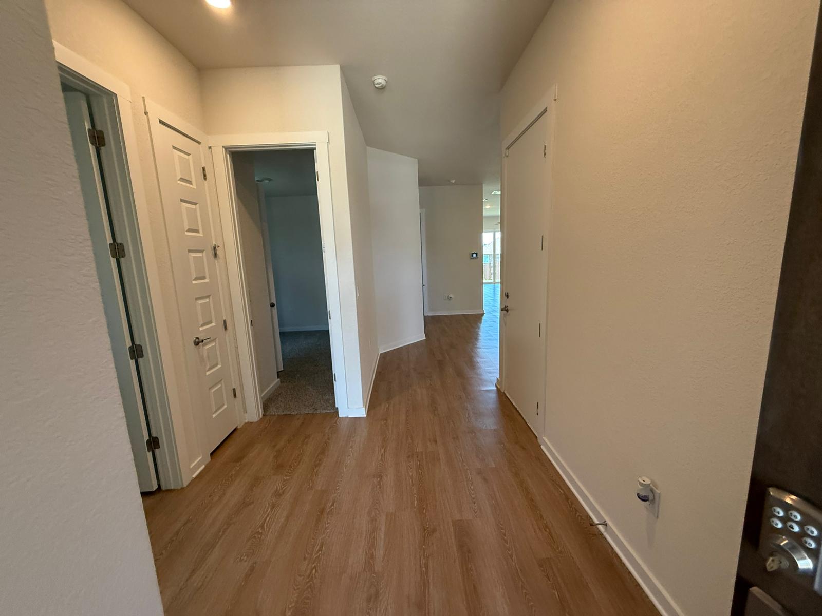 2037 Saddlery Street Leander, TX 78641 - Photo 34 of 38 a view of a hallway with wooden floor