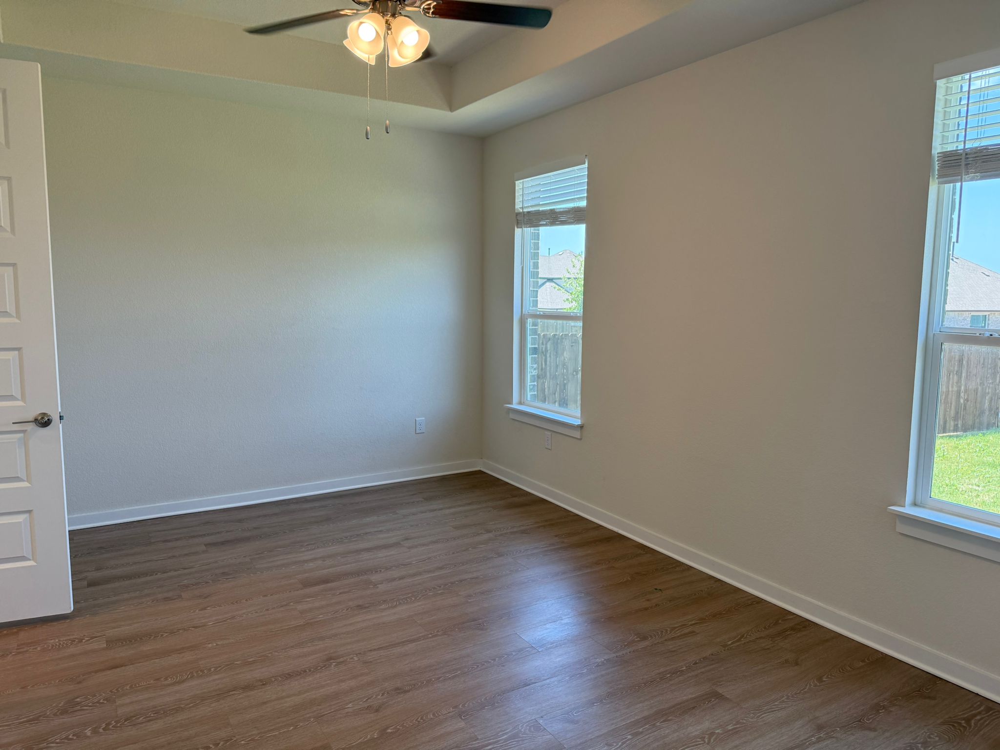 2037 Saddlery Street Leander, TX 78641 - Photo 5 of 38 an empty room with wooden floor and windows