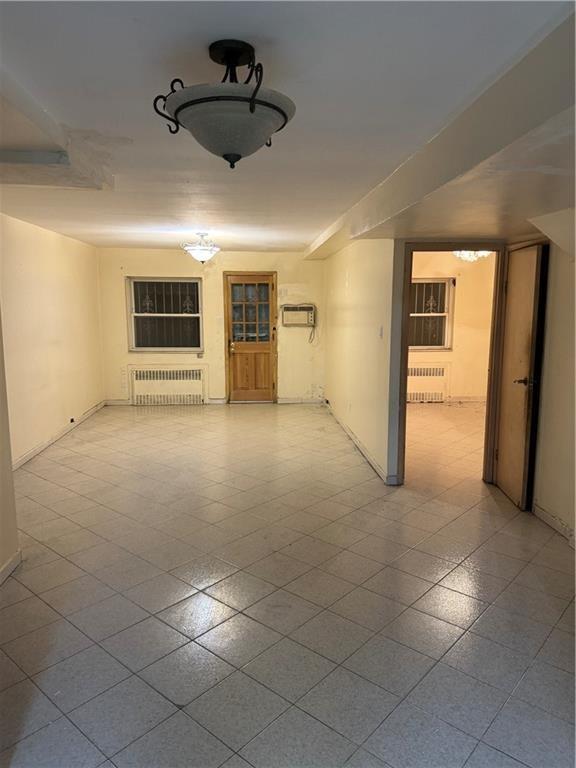 2069 East 55th Street Brooklyn, NY 11234 - Photo 4 of 6 a view of an empty room with window and stainless steel appliances