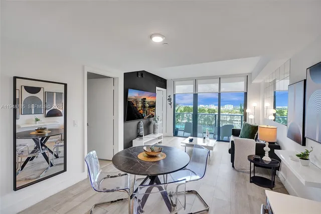 a view of a dining room with furniture window and outside view