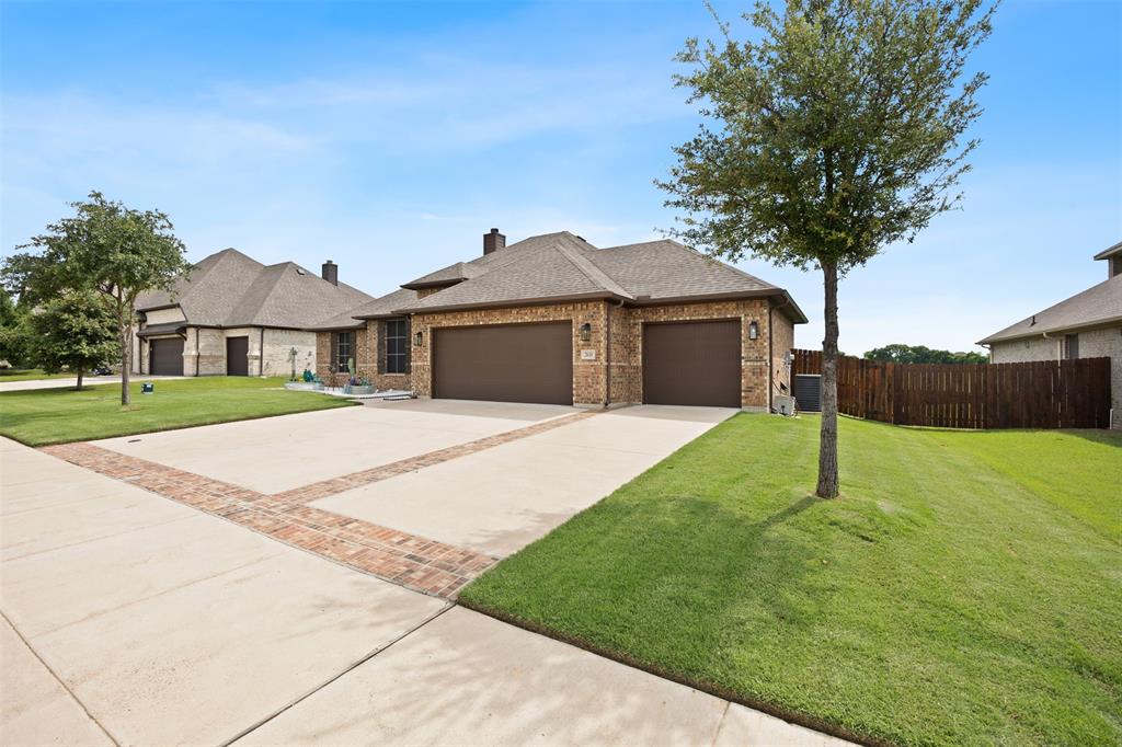 2618 Byrd Ranch Road Midlothian, TX 76065 - Photo 32 of 38 a house with green field in front of it