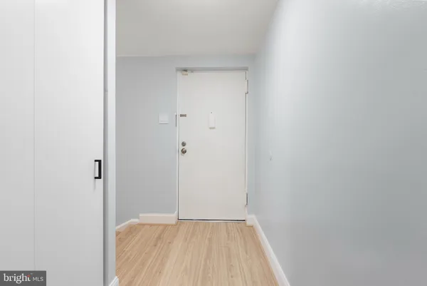 a view of a small space with wooden floor