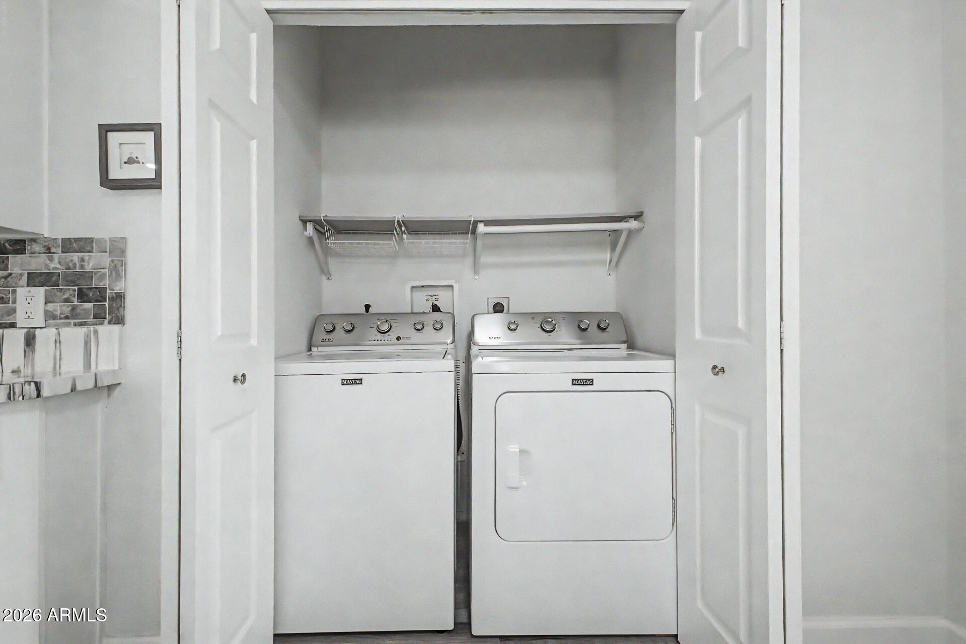 2550 South Ellsworth Road, Unit 50 Mesa, AZ 85209 - Photo 12 of 45 a utility room with dryer and washer