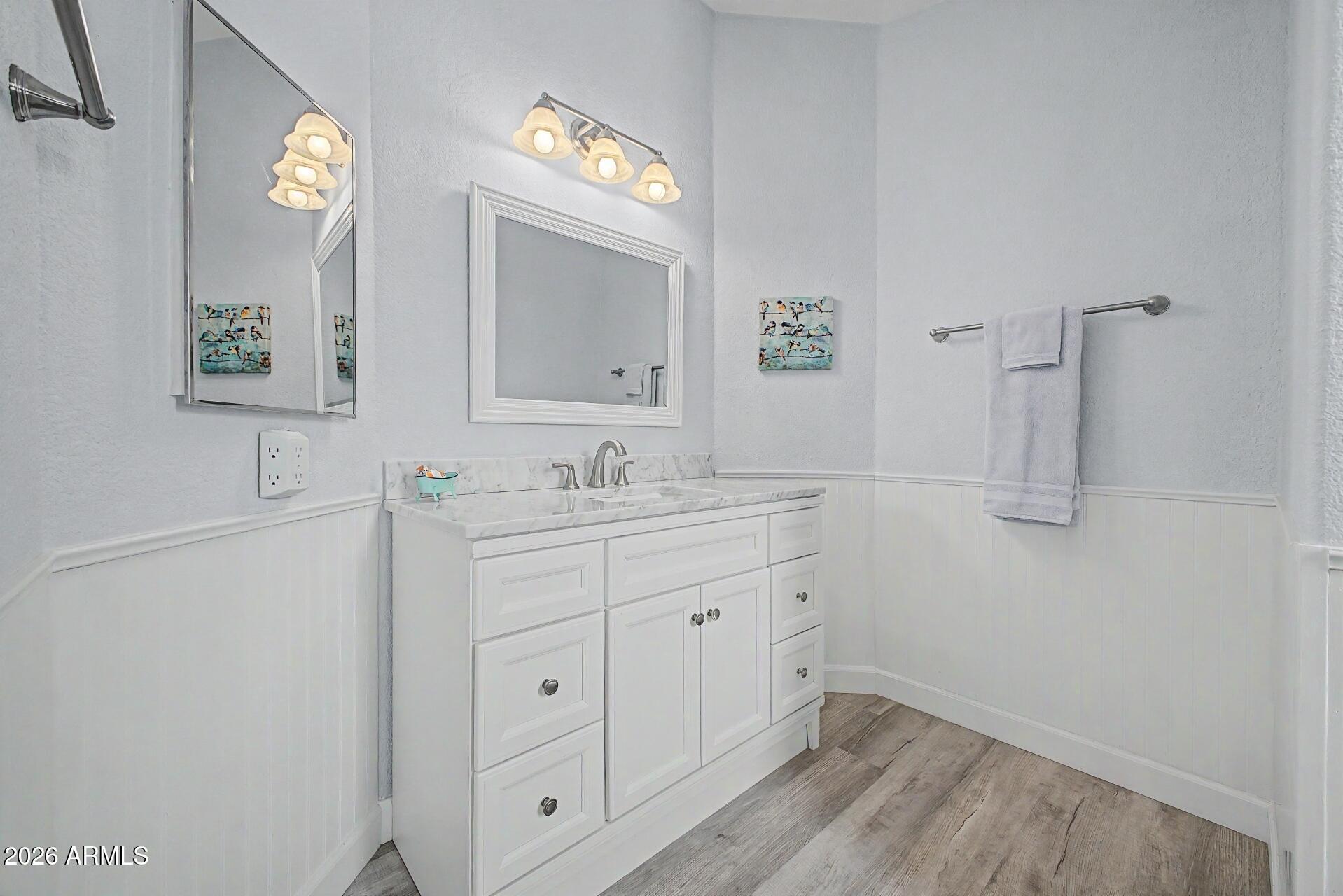 2550 South Ellsworth Road, Unit 50 Mesa, AZ 85209 - Photo 19 of 45 a bathroom with a sink and a mirror