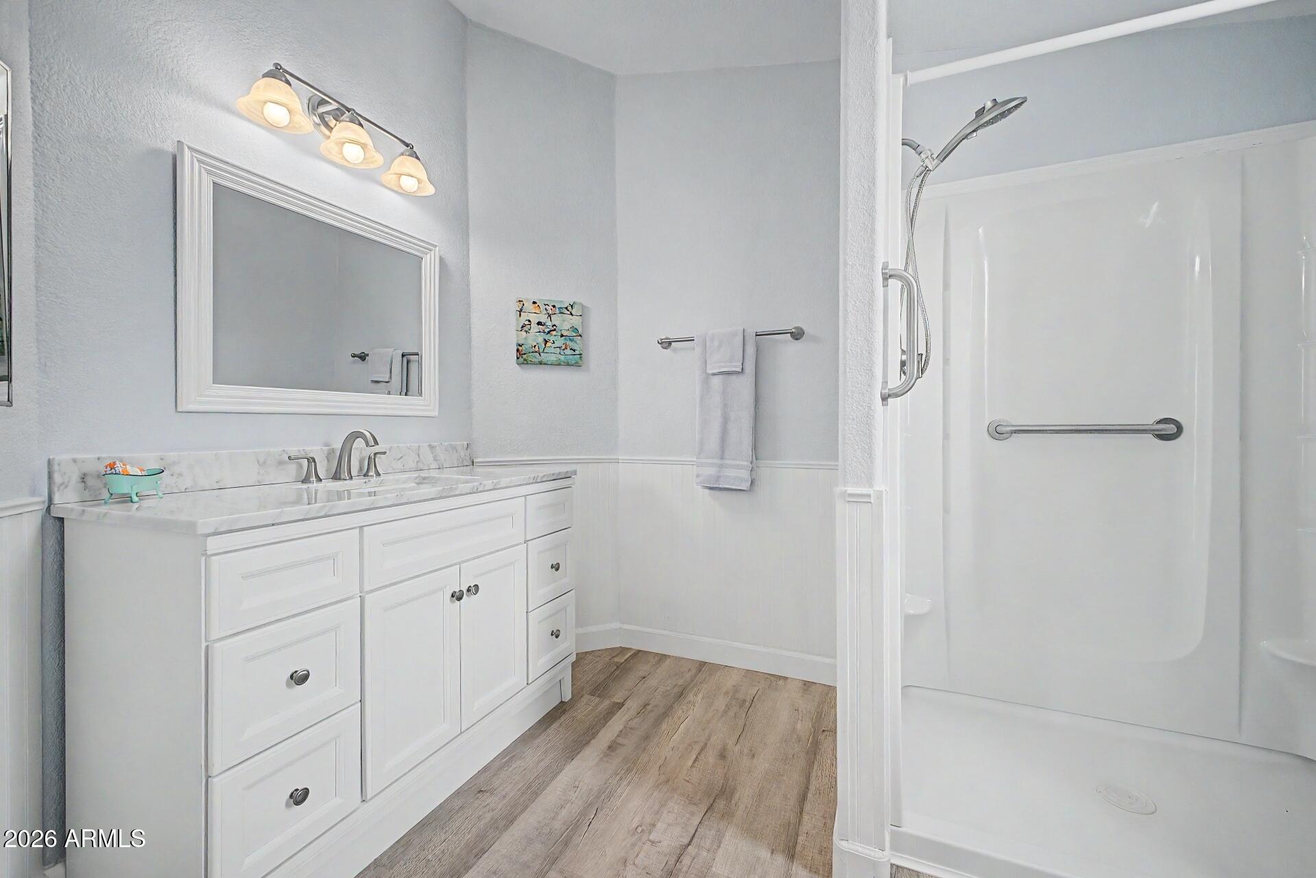2550 South Ellsworth Road, Unit 50 Mesa, AZ 85209 - Photo 20 of 45 a bathroom with double vanity sink and a mirror