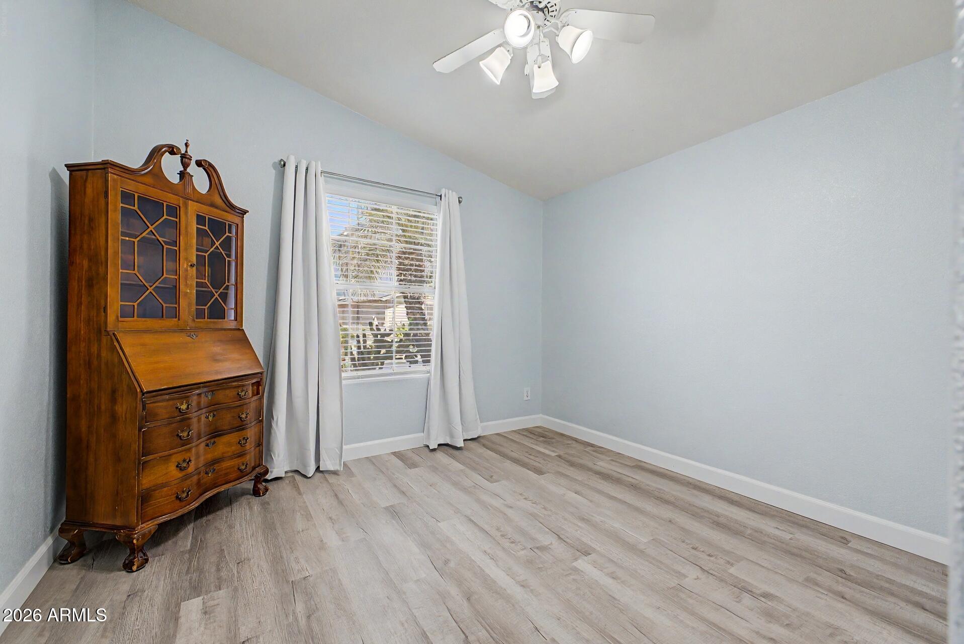 2550 South Ellsworth Road, Unit 50 Mesa, AZ 85209 - Photo 24 of 45 wooden floor in an empty room with a window