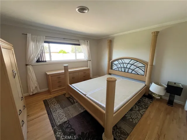 a living room with a bed and furniture